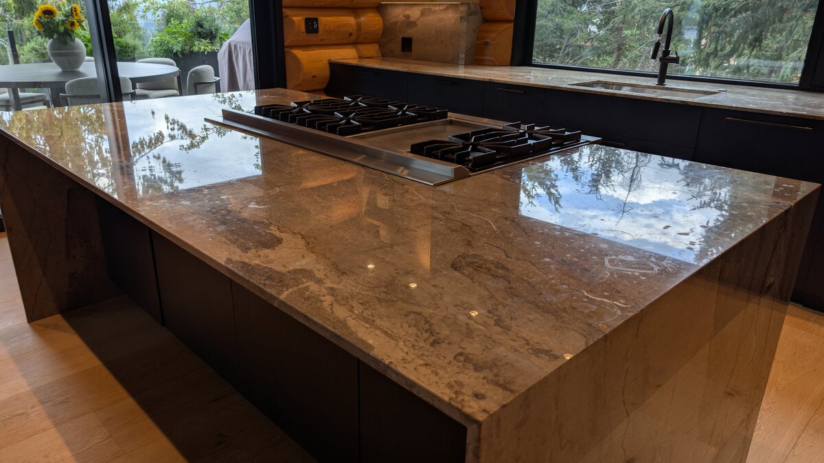Polished stone kitchen island and countertop in a Whistler home